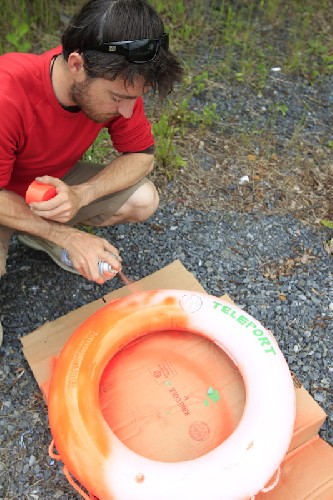 Spray painting our life-ring bright orange so we can see it!