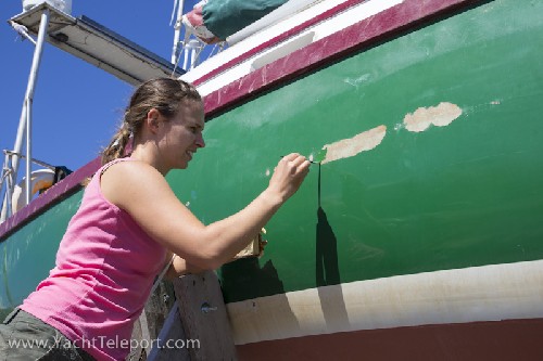Jess re-painting the chafe marks in the hull