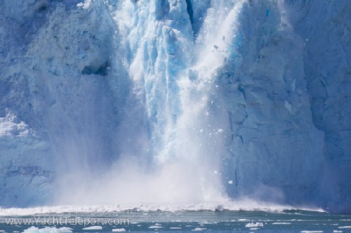 Ice falls from the face of Aialik Glacier - Click for full-size.